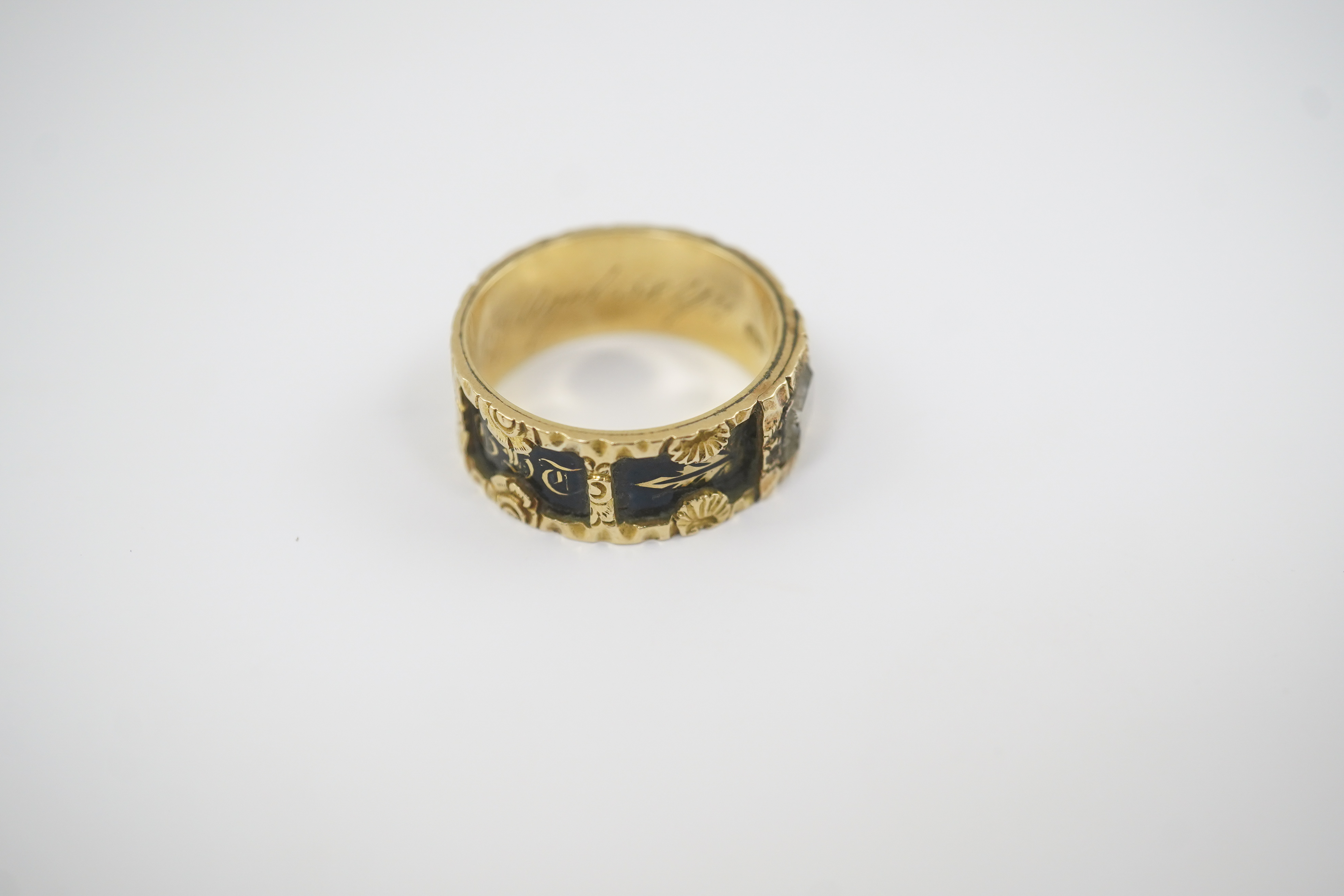 An early Victorian 18ct gold and black enamel initial mourning band